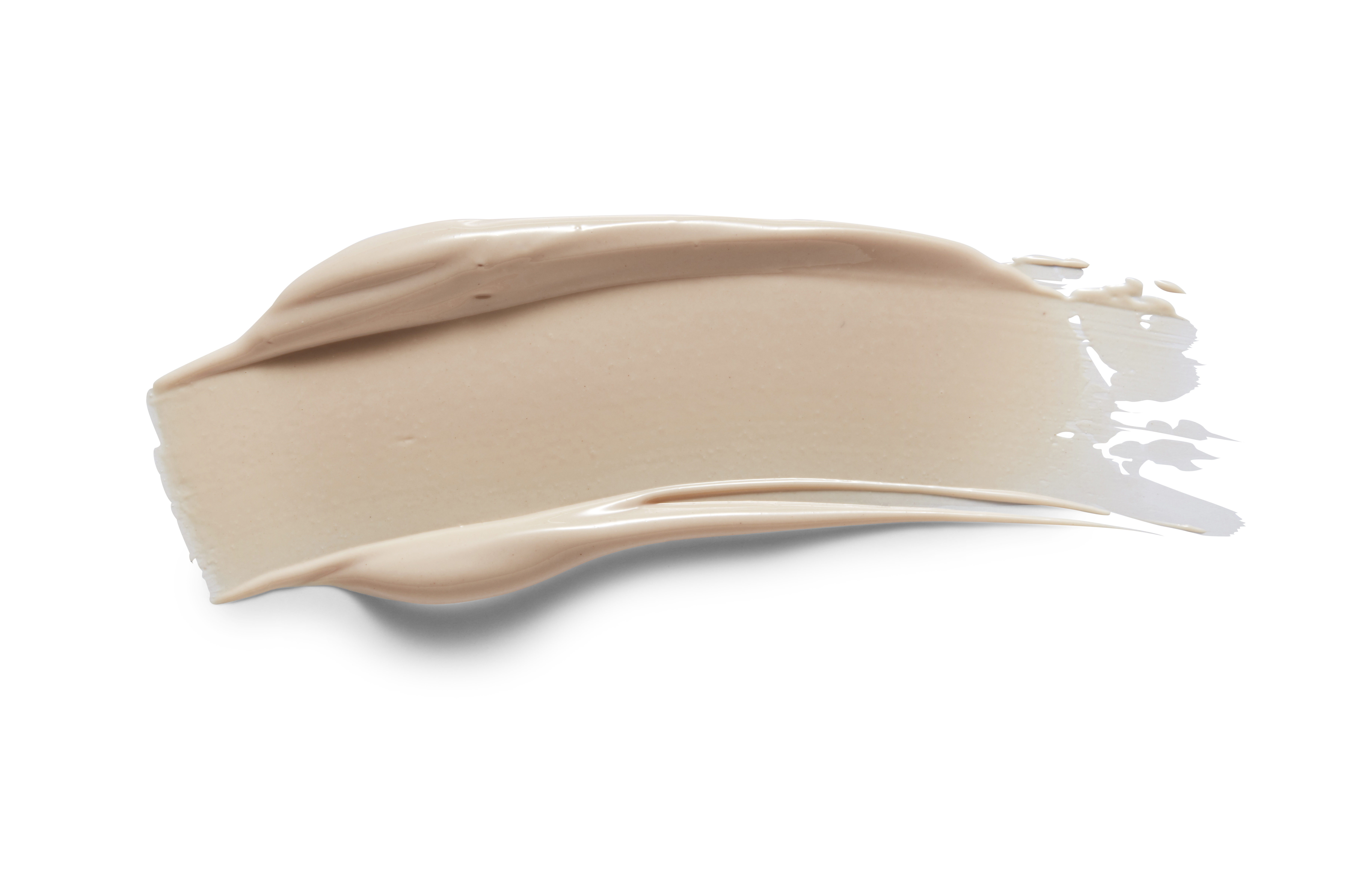 Beige Creme-Make-up auf weißem Hintergrund.