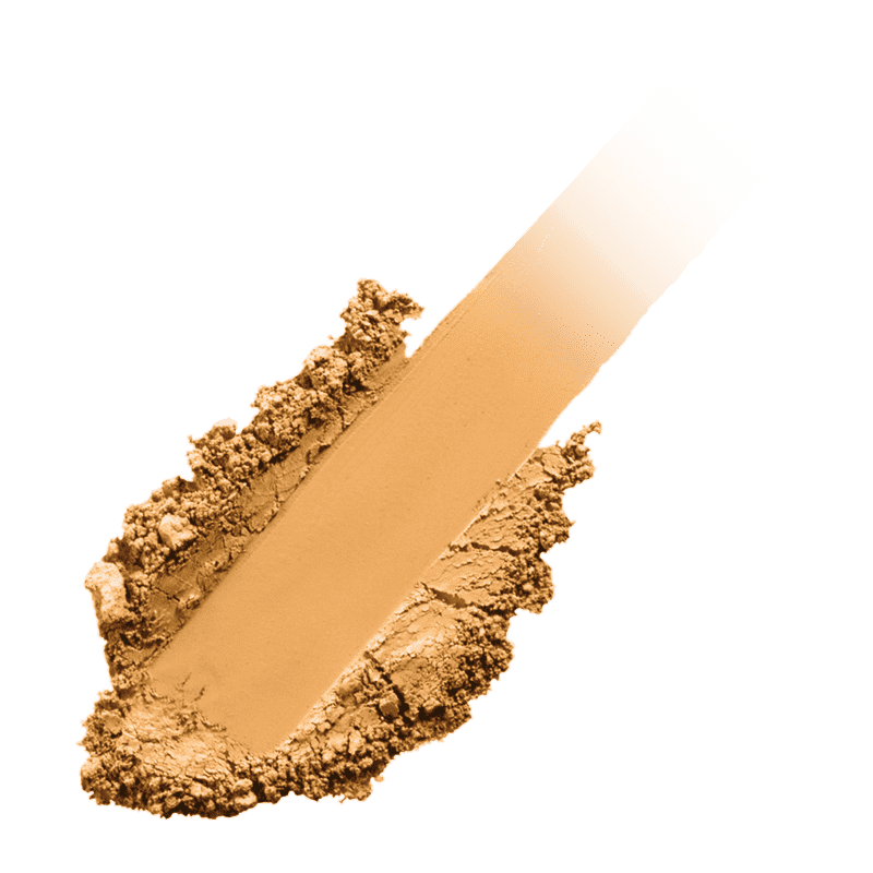 Alt-Text: 'Beige Puderstrich auf grünem Hintergrund'