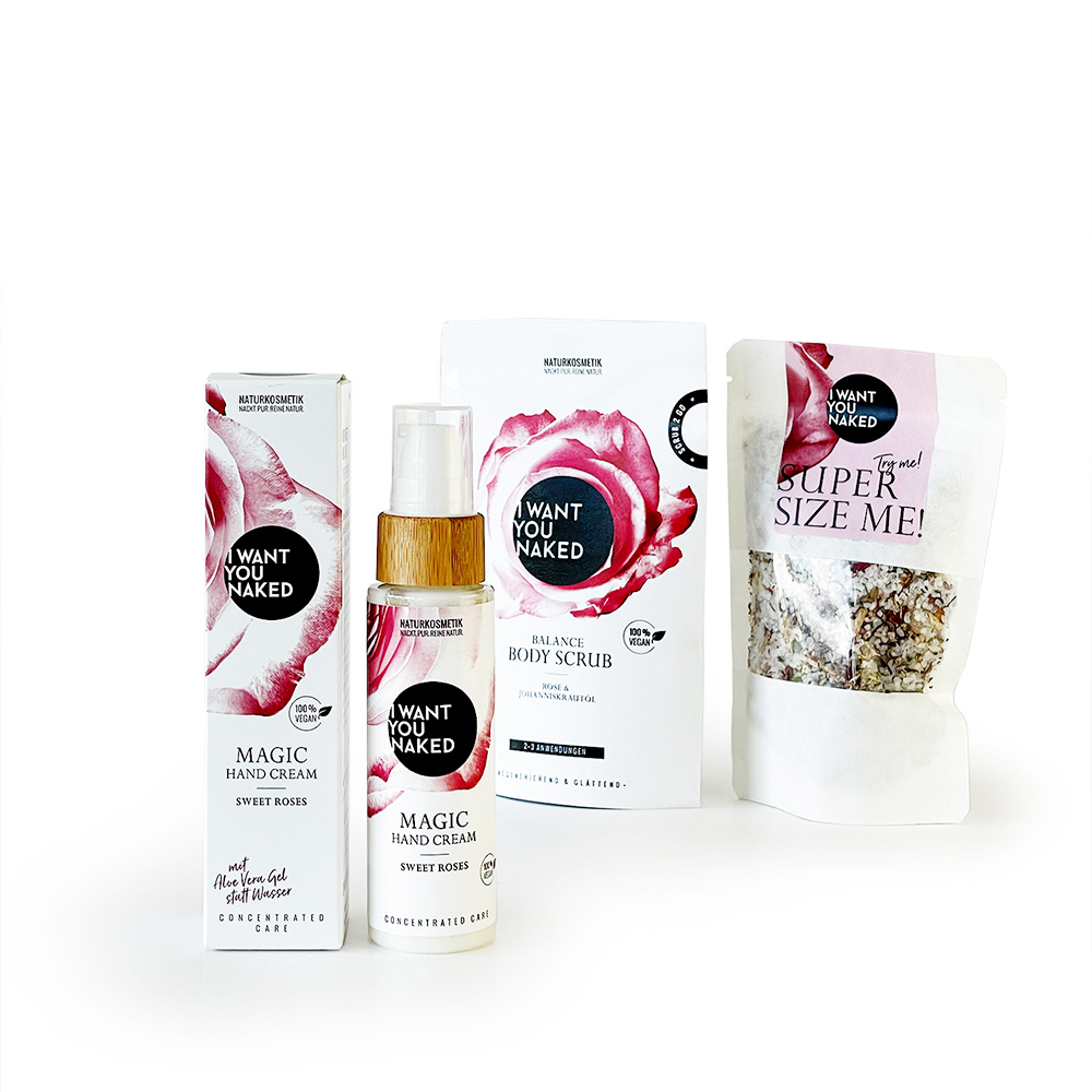 Produkte von 'I Want You Naked': Handcreme, Körperspray und Körperpeeling mit Rosenmotiv.